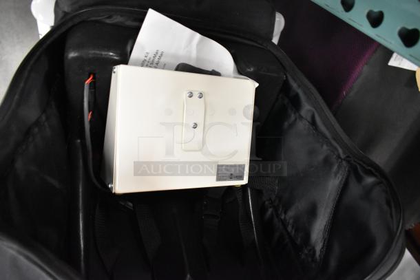 Laerdal SimMan/AirMan portability kit bag with white regulator, visible label, in excellent condition.