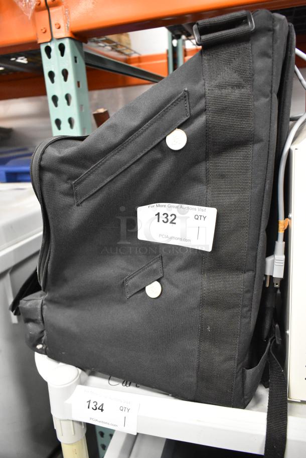 Laerdal SimMan/AirMan Portability Kit Bag with Regulator, black, durable fabric, visible auction tag reading "132 QTY".