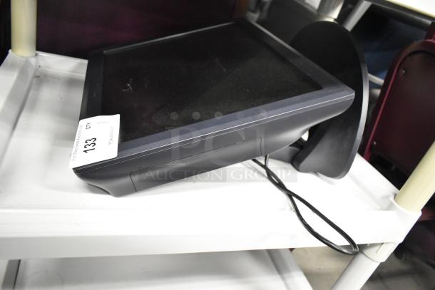 Elo POS Monitor, black, touchscreen, in used condition, with power cable and auction tag labeled "133" visible on stand.