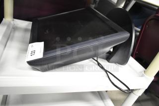 Elo POS Monitor, black, touchscreen, in used condition, with power cable and auction tag labeled "133" visible on stand.