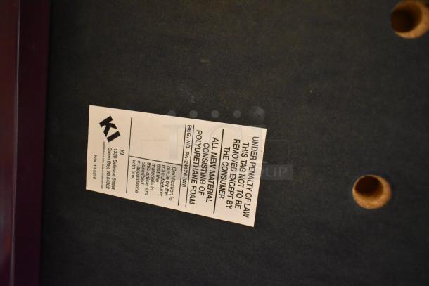 36 maroon metal chairs with cushioned seats and backrests, KI brand tag showing polyurethane foam material, good condition.