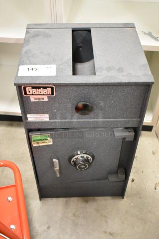 Gardall gray metal single compartment safe, without combination, visible Gardall label, and dial lock mechanism.