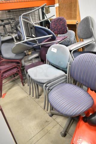 Stack of 38 assorted chairs in various designs and colors, metal frames. Good condition, label visible on chair.