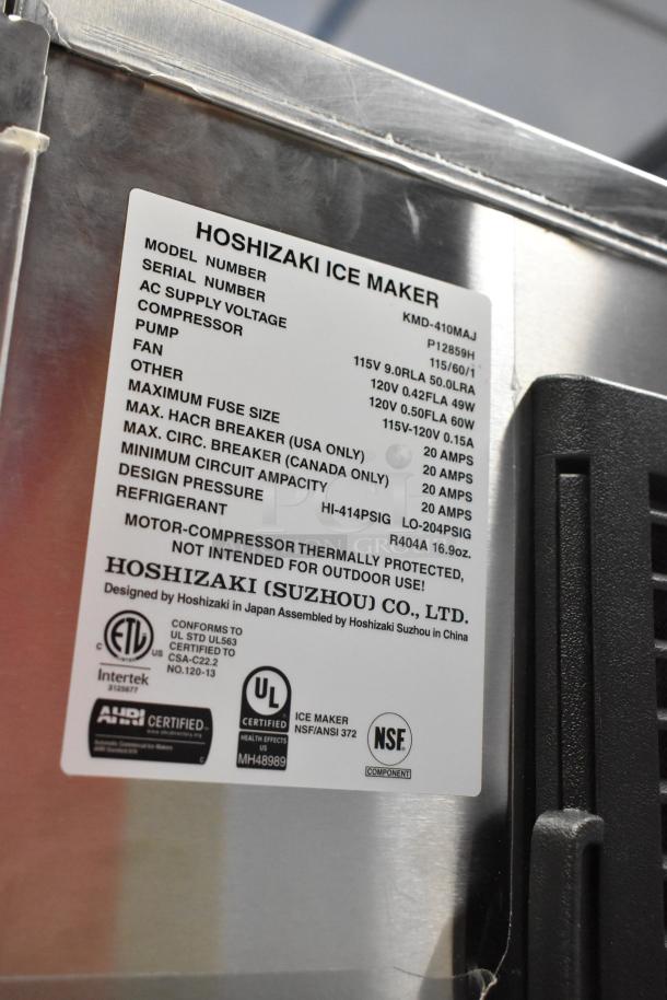 2024 Hoshizaki KMD-410MAJ ice maker on Manitowoc bin, stainless steel, 115V, 1-phase. Features certification labels.