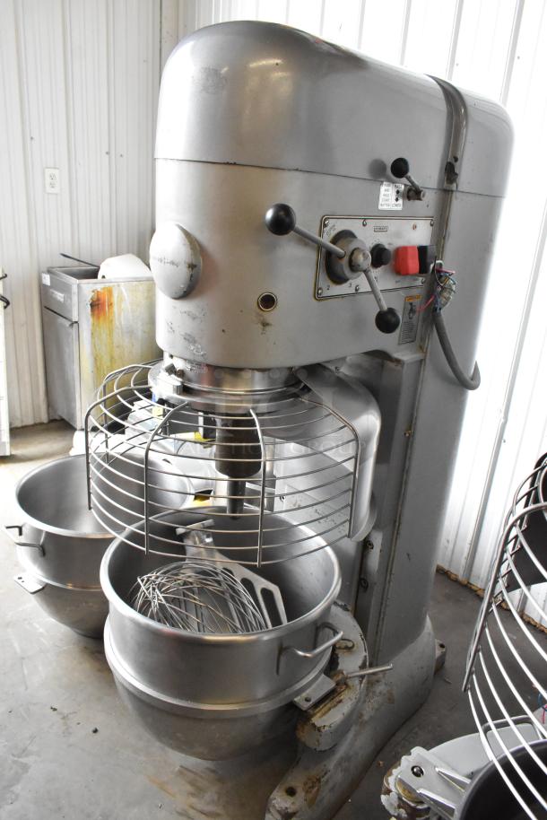 Hobart M-802 commercial 80-quart dough mixer with three bowls, bowl guard, dolly, paddle, whisk attachments; 200V, 3-phase.