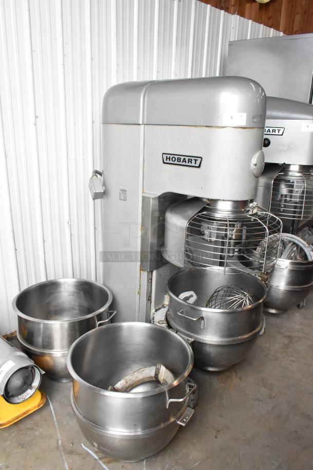 Hobart M-802 80 Quart Dough Mixer, metal finish, includes 3 bowls, bowl guard, dolly, paddle, and whisk attachments.
