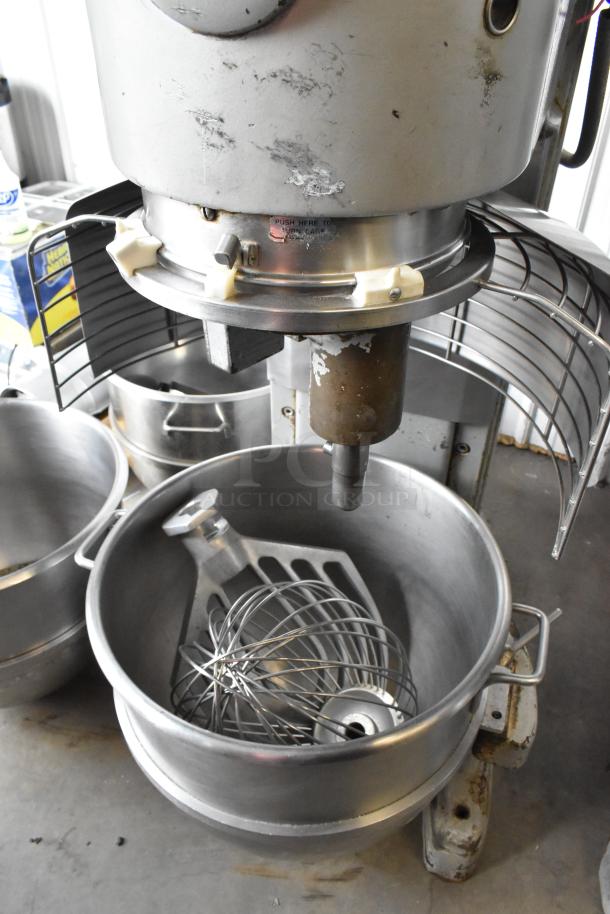 Hobart M-802 80-quart metal dough mixer with bowl guard, bowls, dolly, paddle, and whisk attachments. 200V, 3-phase.