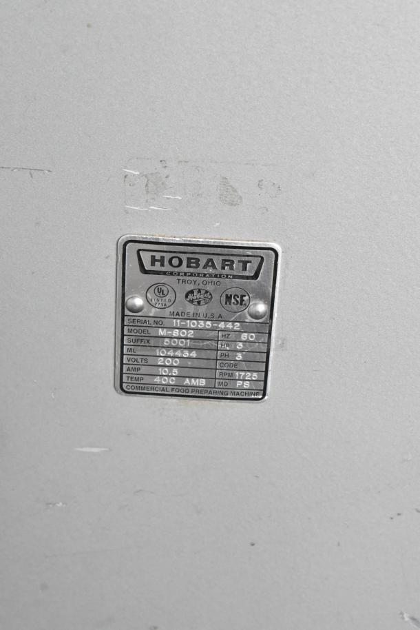 Hobart M-802 mixer label showing model, serial number, voltage (200V), 3 phase, made in USA. Ideal for commercial use.