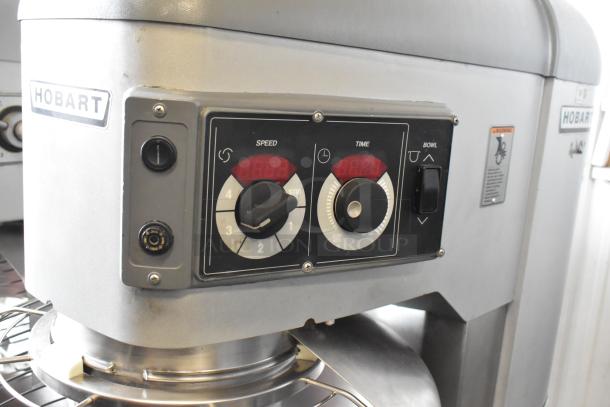Hobart Legacy HL800 80-quart planetary dough mixer with control panel, displayed speed and time dials, and Hobart branding.