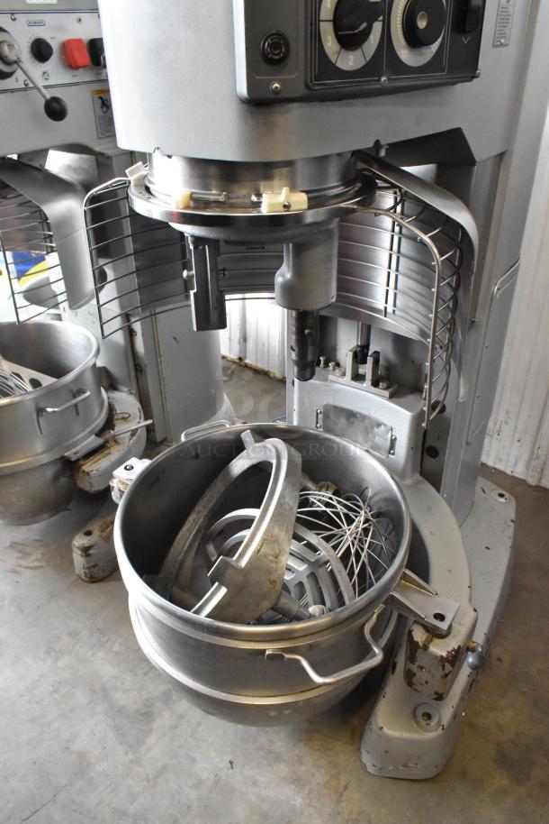 Hobart Legacy HL800 metal commercial 80-quart planetary dough mixer with bowl, bowl guard, dolly, paddle, whisk attachments.