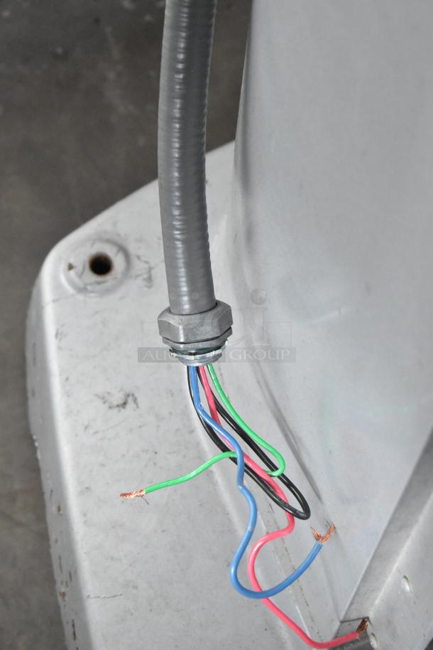 Hobart Legacy HL800 dough mixer wiring, showing exposed color-coded wires and a metal connector on the metal base.