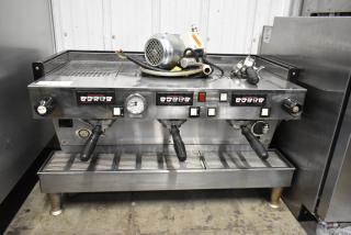 La Marzocco Firenze stainless steel 3-group espresso machine with portafilters, steam wands, and control panel. 220-240V.