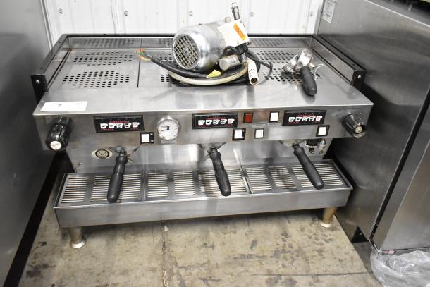 La Marzocco Firenze stainless steel 3-group commercial espresso machine with portafilters and steam wands, 220-240V, used.
