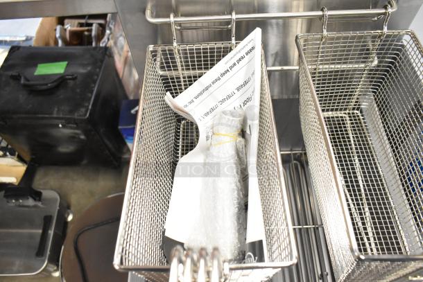 Brand new Avantco 177EF40B stainless steel 40 lb. electric fryer with two metal fry baskets, 208V, commercial use.