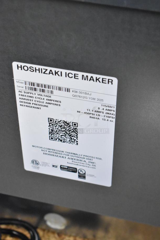 Hoshizaki KM-301BAJ ice machine label, showing model details, voltage, amperage, and refrigerant type. Brand new condition.