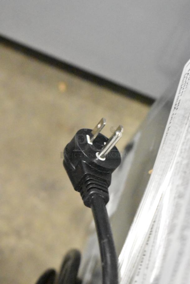 Close-up of a power plug for a 2025 Hoshizaki AM-50BAK ice machine, highlighting a new yet scratch-and-dent condition.