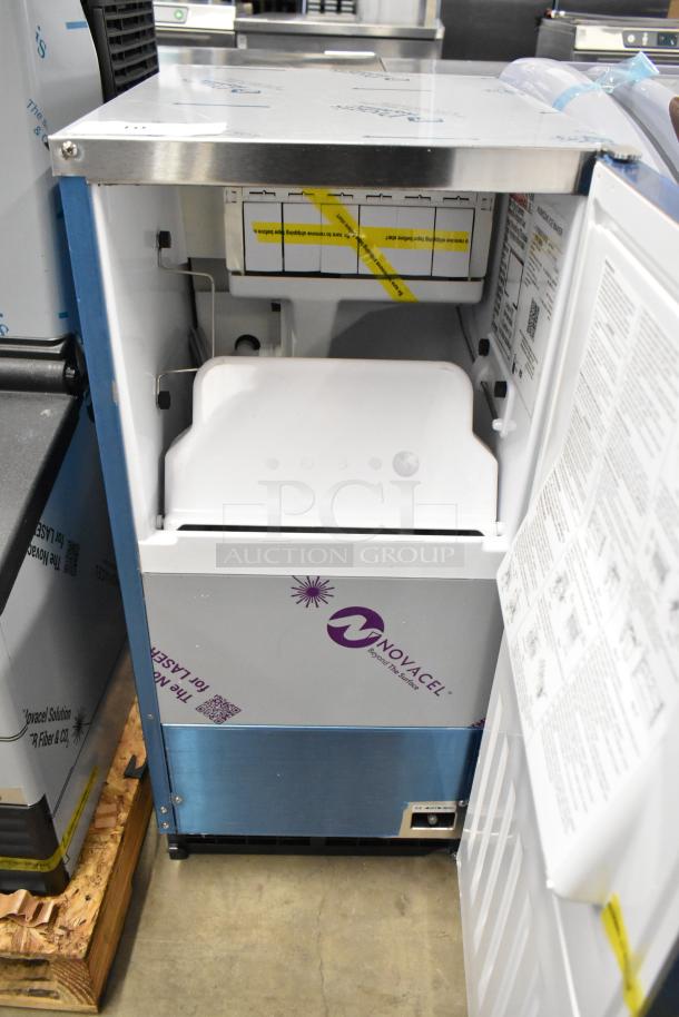 BRAND NEW 2025 Hoshizaki AM-50BAK stainless steel ice machine. Scratch and dent; open view showing interior and labels.