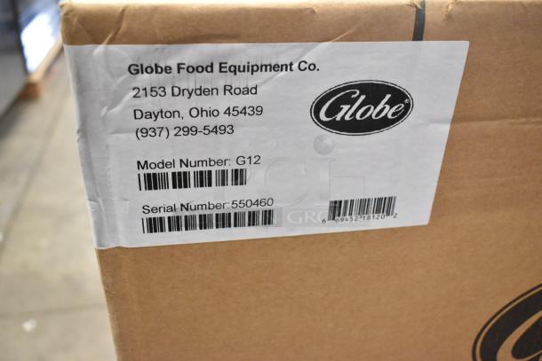 BRAND NEW Globe G12 stainless steel meat slicer, commercial countertop model. 115 volts, 1 phase. Box shows scratch and dent label.