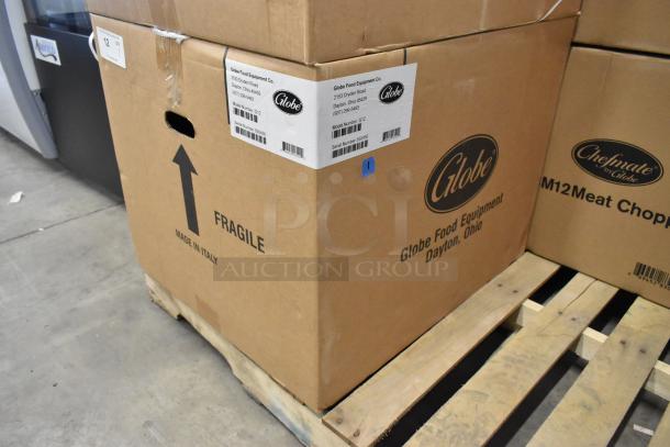 Brand new Globe G12 meat slicer in original box. Box shows labels with model and company info; marked "fragile," "made in Italy."
