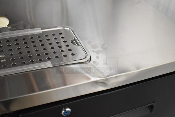 Brand new Avantco 178UDD72HC kegerator with two double tap towers, scratch and dent condition, metal surface detail shown.