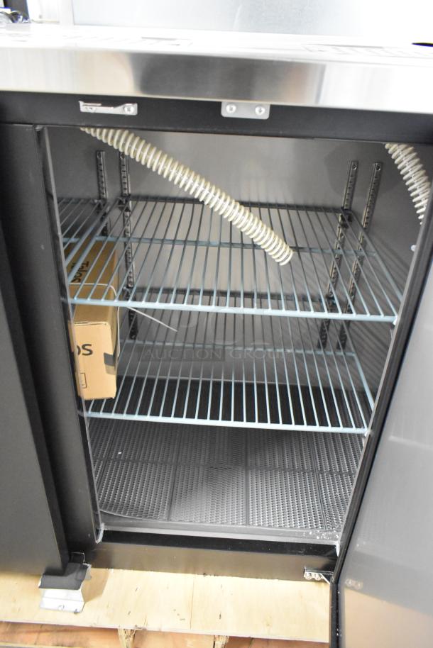 Brand new Avantco 178UDD72HC kegerator interior, showing shelves, hose, and packaging box. Scratch and dent condition.