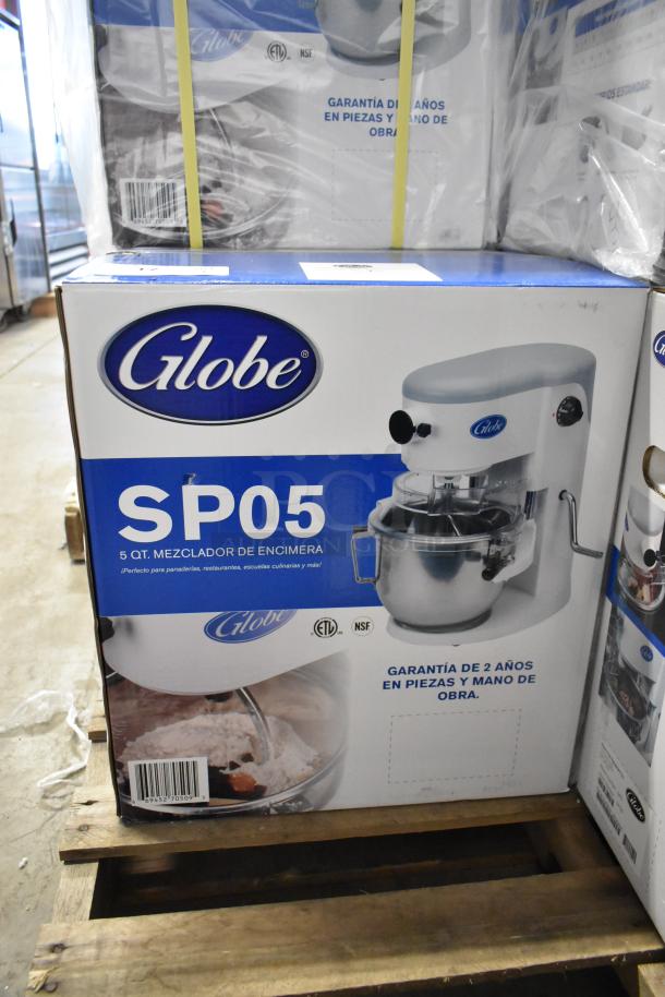 Brand new Globe SP05 5-quart planetary dough mixer, metal, 115 volts, 1 phase. Box shows ETL/NSF certification and warranty info.