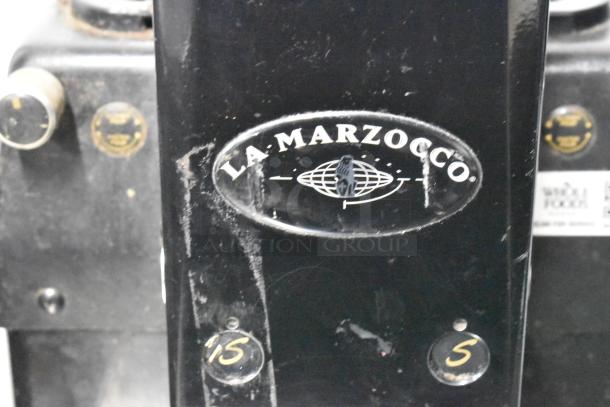 La Marzocco Swift E.P.S.B. metal espresso grinder, missing hoppers, 120V, 1 phase. La Marzocco logo visible.