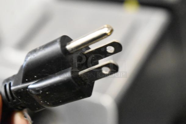 La Marzocco Swift E.P.S.B. espresso grinder, metal body, commercial-grade, missing hoppers, 120V, 1 phase plug detail.