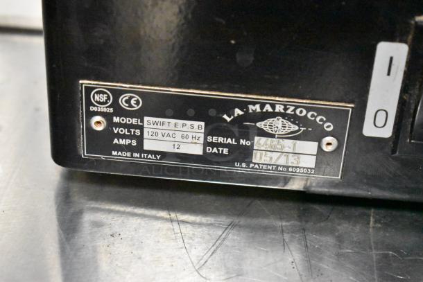 La Marzocco Swift E.P.S.B. metal commercial espresso grinder, 120V, missing hoppers, serial 4465-1, NSF certified.