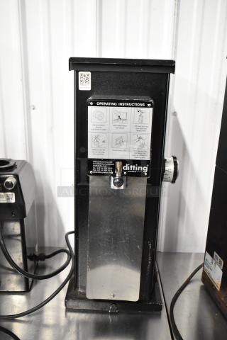 Mahlkonig Ditting KR1203 commercial coffee grinder, black metal, countertop model. Features operating instructions on front.