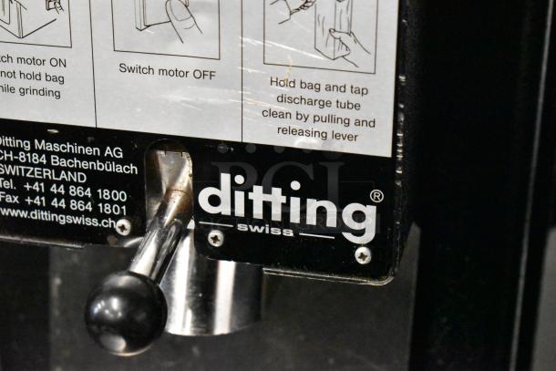 Mahlkonig Ditting KR1203 Coffee Grinder, metal body, commercial use. Label shows model, voltage 120V, 1 phase. Good condition.