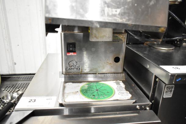 Cornelius NG2000 commercial nut butter grinder, metal body, main power switch visible, some surface wear. Model NG2000, 120V.