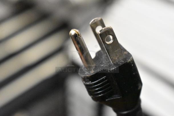 Close-up of a plug for the Jun-Air 87R-4MN1-HSBHH Nitro Brew Nitrogen Generator, highlighting its power connection.