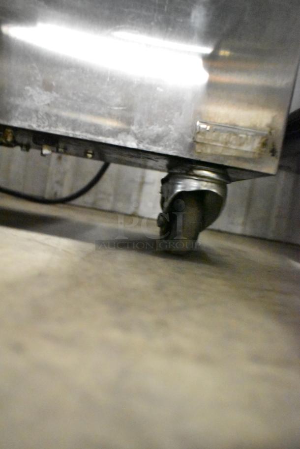 2022 Jun-Air 87R-4MN1-HSBHH stainless steel nitrogen generator on commercial casters, visible caster and metal surface. 120V, 1 phase.