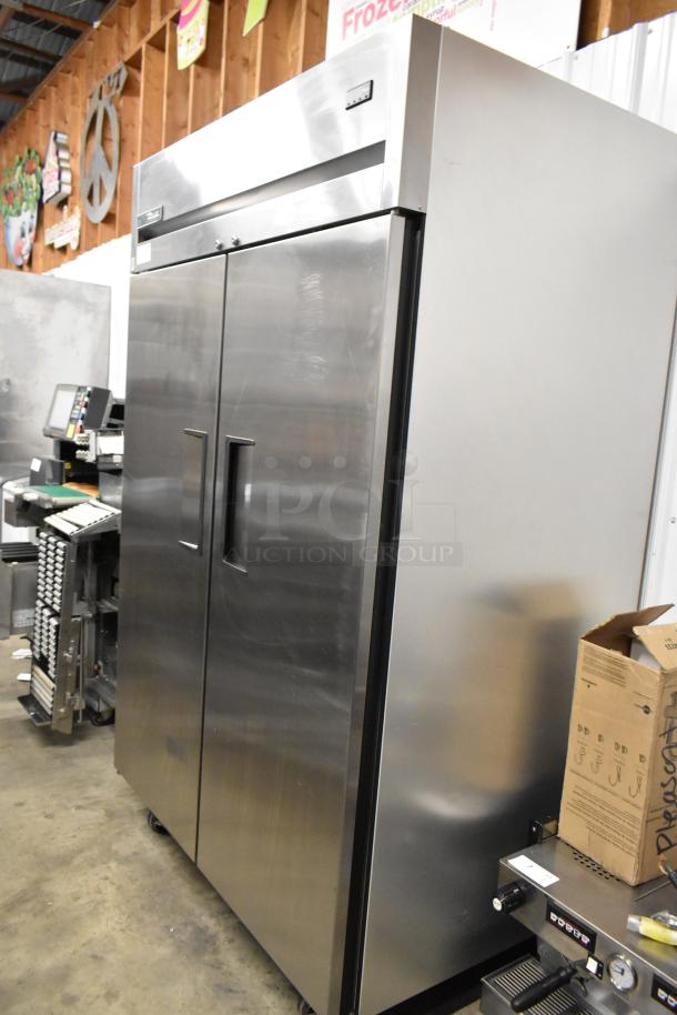 2022 True TG2R-2S-HC stainless steel 2-door commercial cooler with poly-coated racks, on casters, 115V, excellent condition.
