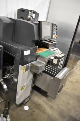 Hobart AW-4600 metal commercial floor heat shrink wrap station, featuring control panel and conveyor belt, in used condition.