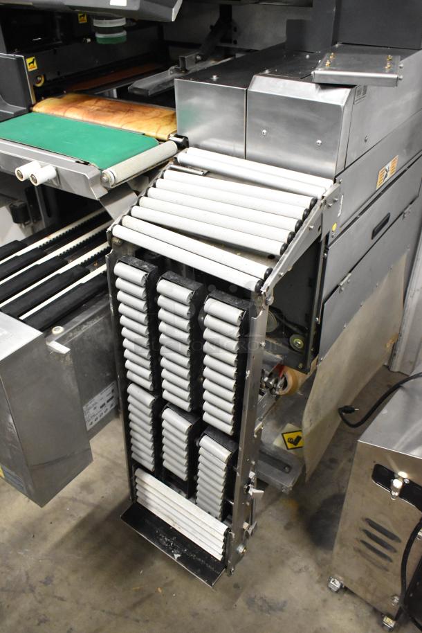 Hobart AW-4600 metal commercial floor style heat shrink wrap station with roller conveyor. In good condition.