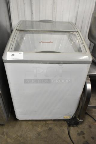 SD-151 metal commercial chest freezer merchandiser with glass top, on commercial casters. 115 volts, 1 phase. Light wear visible.