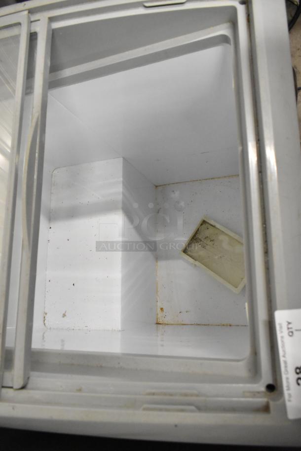 SD-151 metal commercial chest freezer merchandiser interior view, showing white interior with some wear. Model SD-151.