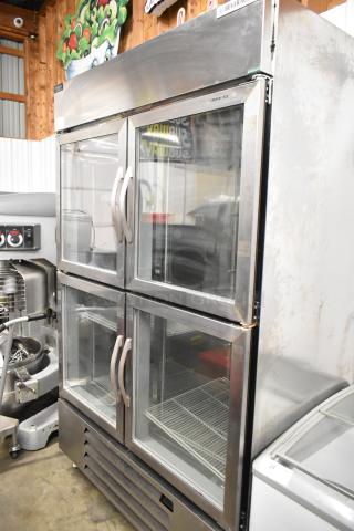 Beverage Air HBR49HC-1-HG stainless steel cooler with four half-size glass doors, poly-coated racks, on commercial casters.