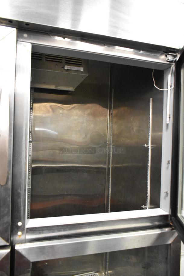 Beverage Air HBR49HC-1-HG stainless steel commercial cooler with 4 half-size glass doors, poly-coated racks, on casters.