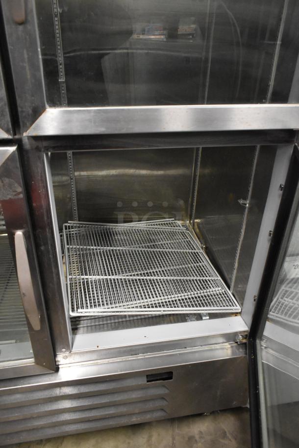 Beverage Air HBR49HC-1-HG stainless steel commercial cooler with four half-size glass doors, poly-coated racks, on casters.