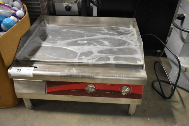 Avantco 177EG24N stainless steel electric griddle, flat top, 208/240V, 1 phase, countertop model, knobs visible.