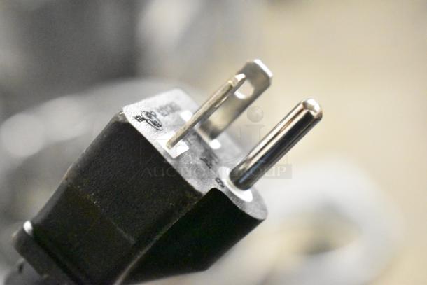 Close-up of an electric plug for Avantco 177EG24N stainless steel commercial countertop griddle, 208/240V, 1 Phase.