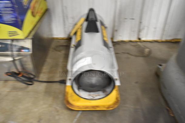 DeWalt DXH50K 50,000 BTU forced air kerosene heater, gray and yellow, visible wear, suitable for large spaces.