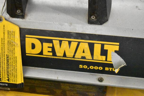 DeWalt DXH50K 50,000 BTU forced air kerosene heater, worn label, visible yellow warning tag.