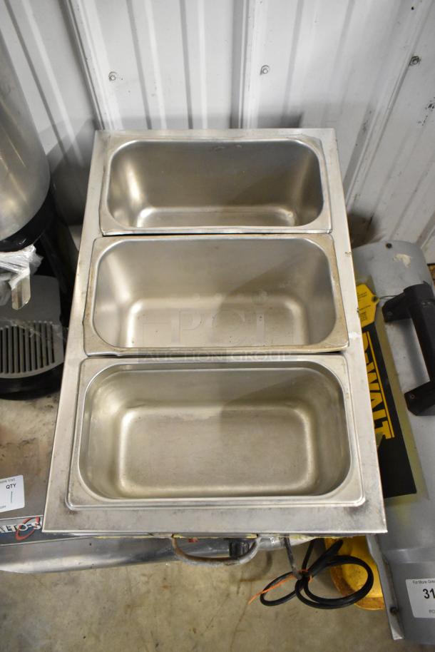 Metal countertop food warmer with three compartments, 120 volts, 1 phase. Well-maintained, suitable for commercial use.