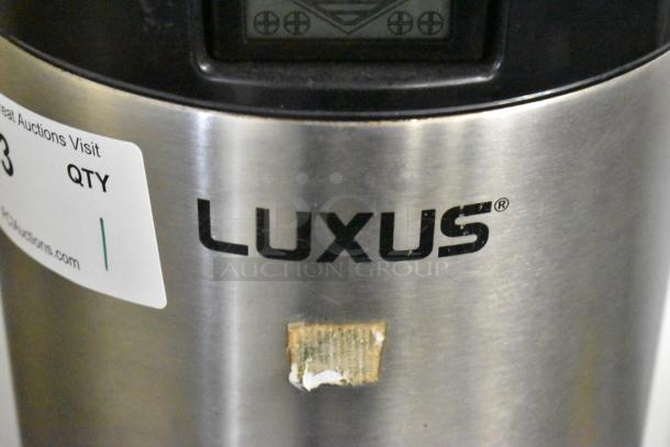 Fetco L4S-15 Luxus Beverage Dispenser, stainless steel, visible label and screen, minor surface marks.