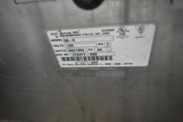 Alto Shaam 500-1D stainless steel warming drawer label, showing 120 volts, 500/1050 watts, model, and serial number details.
