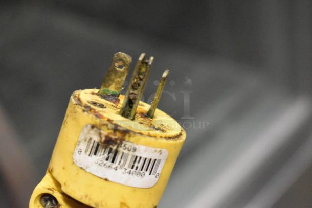 Close-up of a weathered yellow electrical plug for a Gold Medal 8050 FW-12 fryer, showing corrosion and wear.